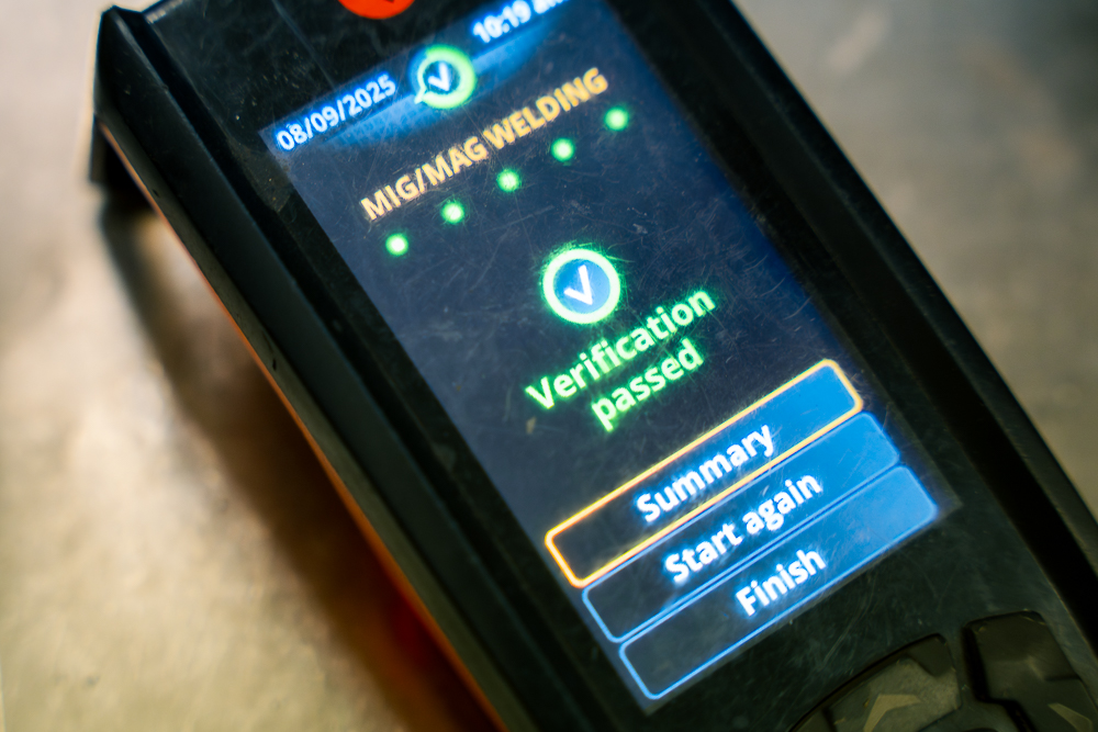 Digital control device showing verification passed screen.